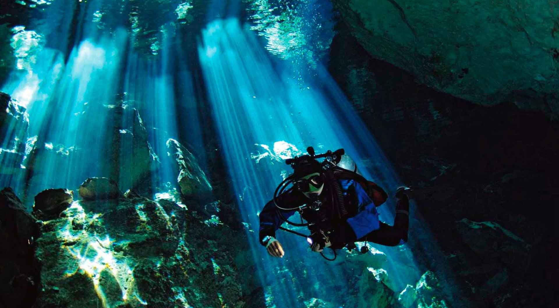 Diver cave diving in cenotes